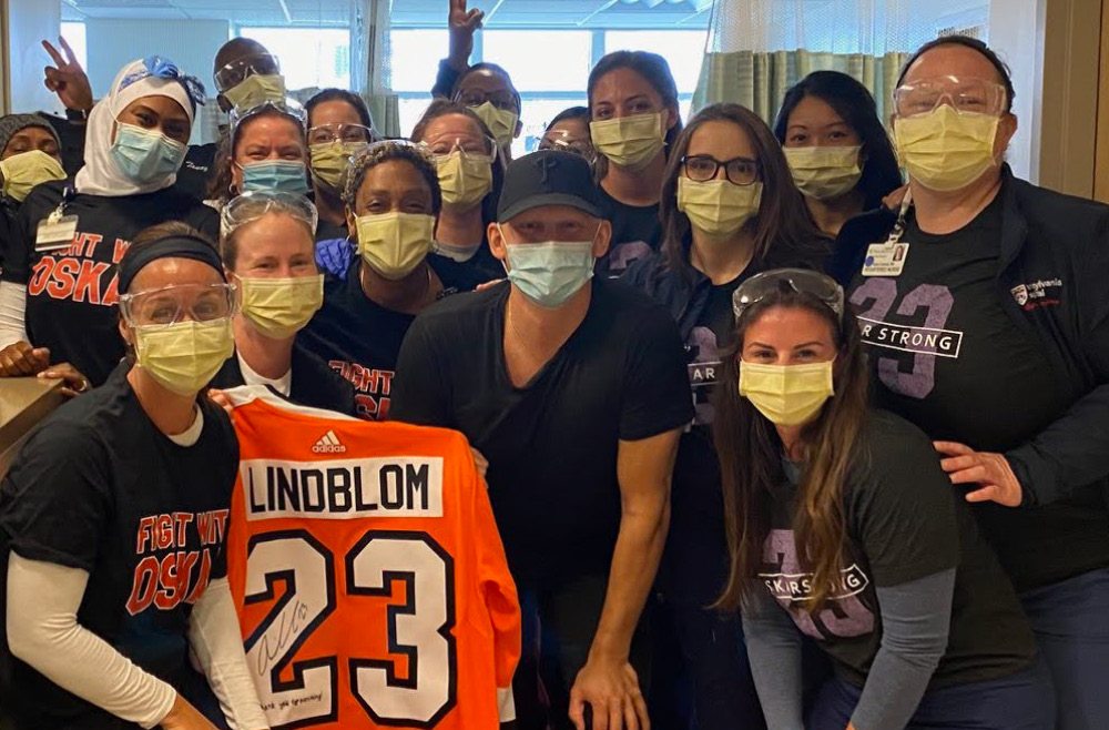 A group of Infusion Services nurses with Flyers forward Oskar Lindblom in 2020